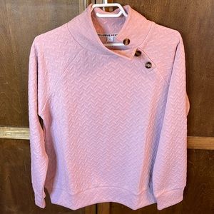 Exclusive pink sweatshirt with button side collar.